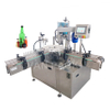 Machina de llenado de líquido de vidrio de doble cabeza giratoria giratoria automática YTSP